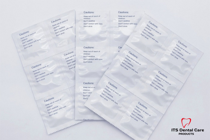 Printed foil sachet packaging with ITS Dental Care logo at lower right
